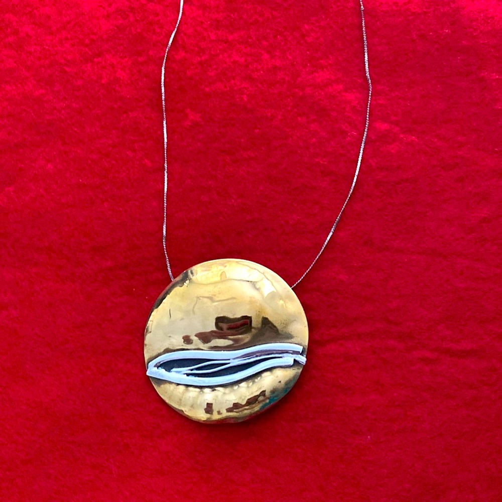 Sue Sachs -pendant or pin - brass and Sterling silver - artist signed.